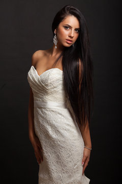 young beautiful caucasian brunette in gorgeous dress, motion shot