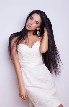 young beautiful caucasian brunette in gorgeous dress, motion shot