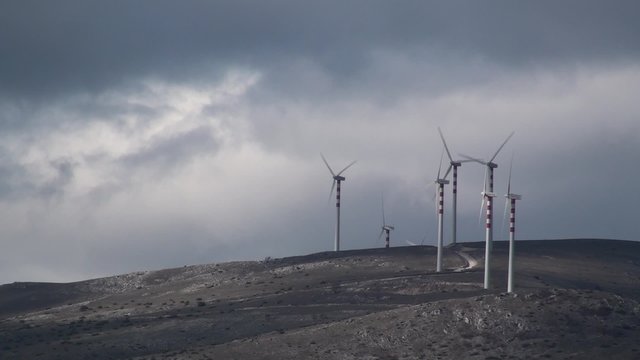 Wind turbines on green hills of Molise, Southern Italy landscape Renewable energy wind farm in the rural countryside of Molise, Italy
