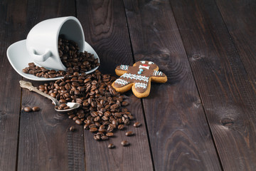 roasted coffee bean in a cup on wood background
