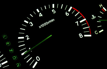 The tachometer on the instrument panel in the car