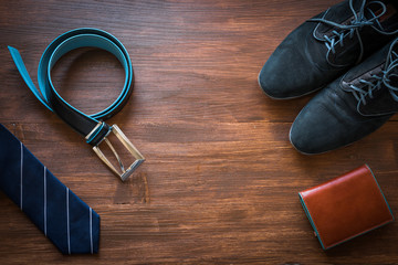 Men fashion accessories. Men wallet, belt, shoes and tie. Still life. Business look.
