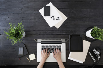 Working with laptop at home office