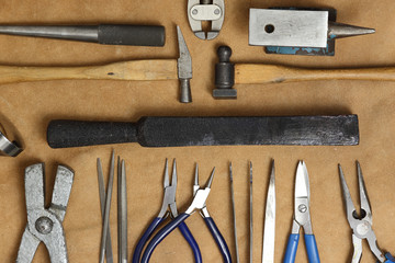 Tools of jewellery. Jewelry workplace on leather background with copy space for text. Top view.