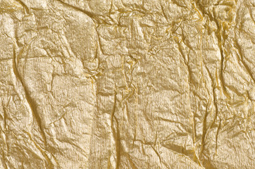 gold crumpled metallic foil background texture