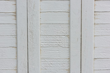 window with closed beige wooden shutters