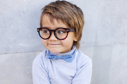 Portrait of smiling little boy wearing oversized spectacles