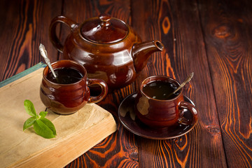 Cup with green tea on wooden background