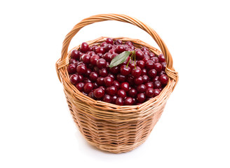 Basket full of fresh red cherry on a white background