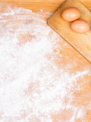 baking background with pastry board, flour and eggs