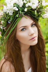 Beautiful girl with flower wreath