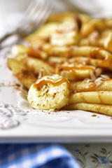 Pancakes with banana,caramel,nuts and cinnamon.