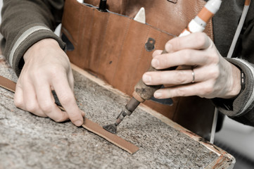 Trunk Maker at work in his luxury leather workshop