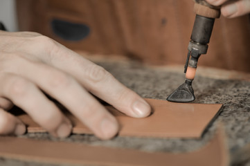 Trunk Maker at work in his luxury leather workshop