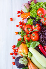 Fresh vegetables on a wooden flat lay.