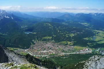 Fototapeta na wymiar Vista from the Karwendel peak of the township Mittenwald, Bavaria, Germany from 2300 m above sea level. July, 2013.