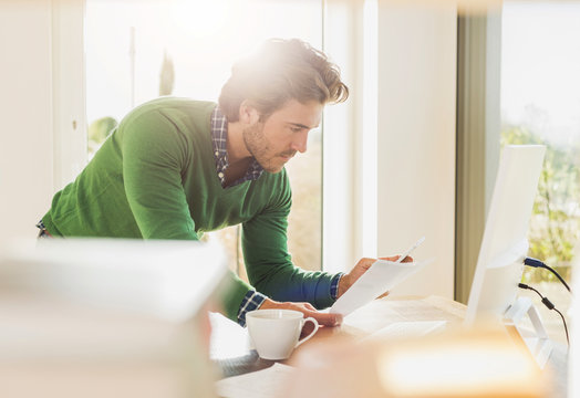 Young man working at home office