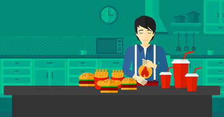 Man suffering from heartburn.