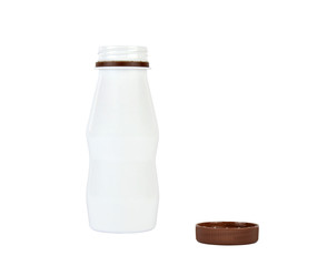Opened white plastic bottle with brown cap on white background