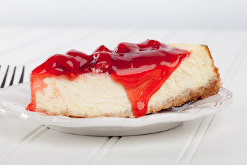 Homemade cherry cheesecake side view with fork