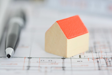 Close-up of House mock-up on blueprints