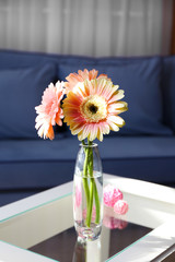 Bouquet of pink gerberas on the table in room