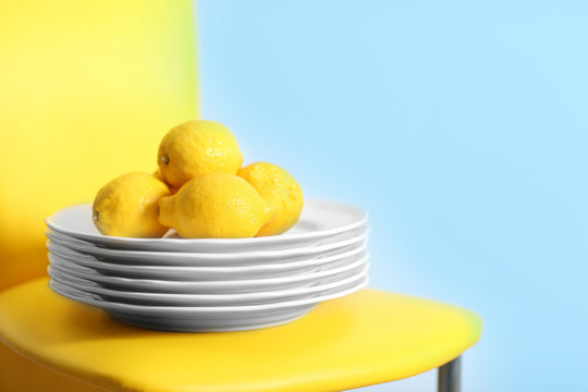 Plate of lemons on a chair, closeup