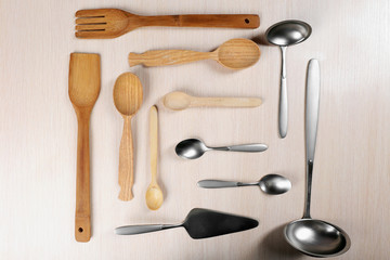 Wooden and silver cutlery set on a table