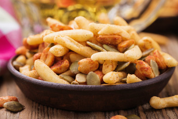 Nuts and crackers to beer, close-up