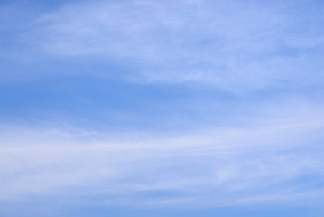 Blue sky with spindrift clouds.