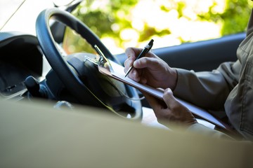 Delivery man sitting in his van