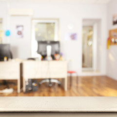 Empty wooden table and blurred office interior background