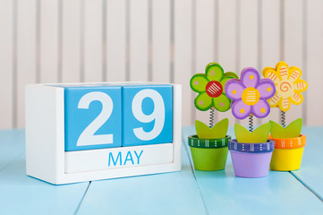 May 29th. Image of may 29 wooden color calendar on white background with flowers. Spring day, empty space for text. International Day Of United Nations Peacekeepers