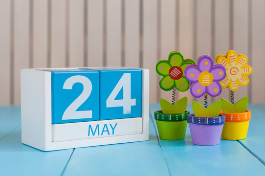 May 24th. Image of may 24 wooden color calendar on white background with flowers. Spring day, empty space for text. The European Day Of Parks, EDoP
