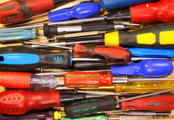Many various old fashioned screwdrivers