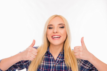 Attractive blonde with beaming smile showing thumbs up