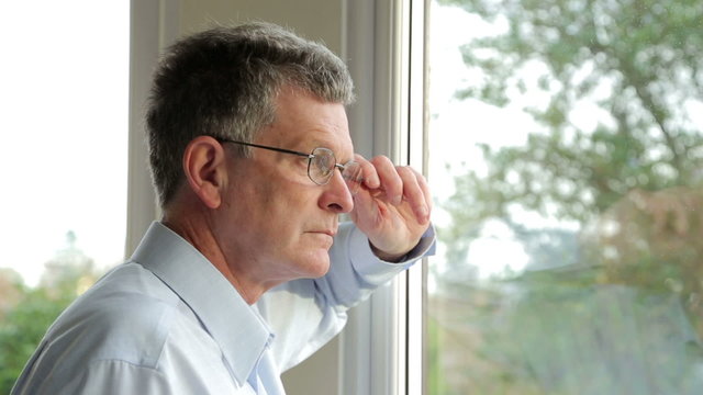 Close Up, Serious, Sad Middle Aged Man Looks Out Of The Window