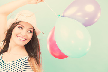 Joyful girl have fun with colorful balloons.