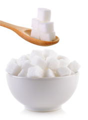 Fototapeta na wymiar sugar cube in the bowl and wood spoon on white background