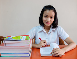  thai young woman student reading a book