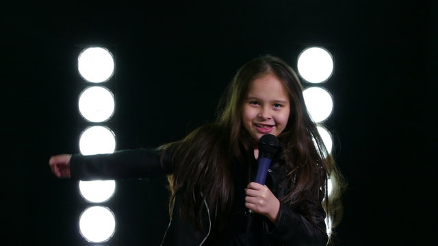 Young Asian American girl thanking crowd