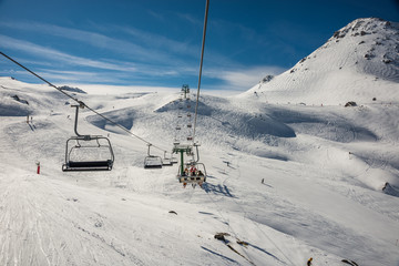 Fototapeta na wymiar Chairlift in winter resort from formigal