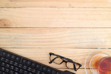 Office table with notepad, computer and coffee cup and computer mouse. View from above with copy space