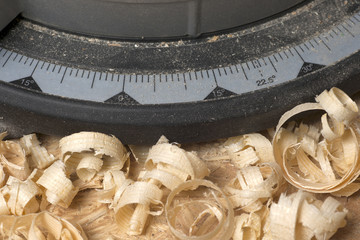 Carpenter tools on wooden table with sawdust. Carpenter workplace top view