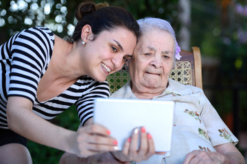 girl take selfie with grandma