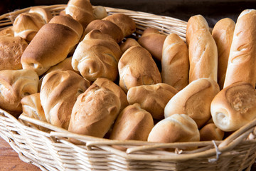 Wicker basket filled with assorted bread rolls