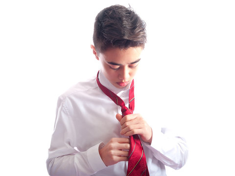 Teenage Boy Tying A Tie