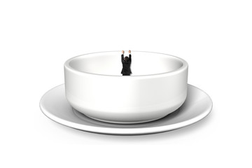 Businessman hanging on edge of empty soup bowl
