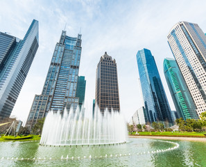 city fountain with modern buildings