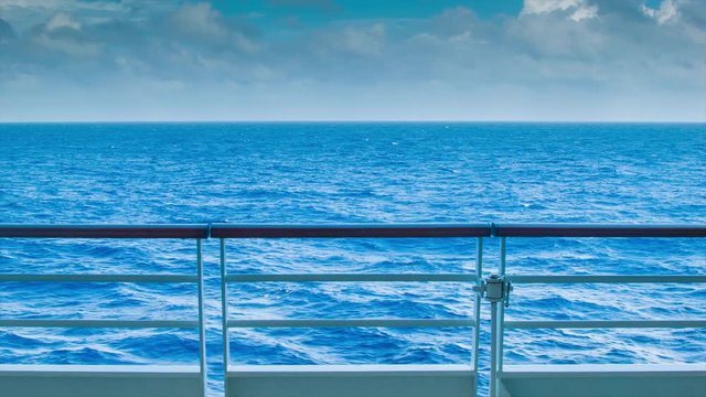 An Ocean Landscape View from the Deck of a Ship at Sea with a Steel and Wood Railing